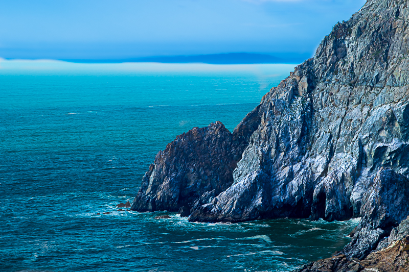 Devil's Slide cliffs — sheer rock dropping into the churning Pacific